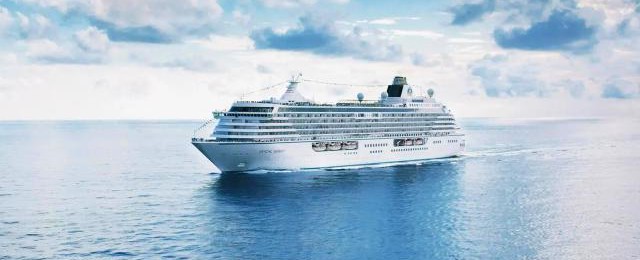 A massive fjord with sheer rock walls meeting the cold, dark waters of the North Atlantic